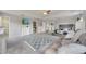Expansive main bedroom with an adjacent walk-in closet, plush carpet, and a cozy seating area for relaxation at 325 Aldridge Ln, Davenport, FL 33897
