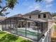 A home features a screened-in pool enclosure, providing a private backyard oasis at 325 Aldridge Ln, Davenport, FL 33897