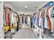 Spacious walk-in closet with organized shelving and ample hanging space for a well-organized wardrobe at 325 Aldridge Ln, Davenport, FL 33897
