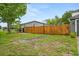 Fenced backyard with mature trees, offers privacy and shade at 3591 Sandlor Dr, Deltona, FL 32738