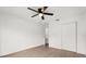 Bright bedroom with wood-look flooring, a ceiling fan, and double door closet at 3591 Sandlor Dr, Deltona, FL 32738