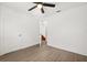 Bedroom featuring a ceiling fan and an open door at 3591 Sandlor Dr, Deltona, FL 32738