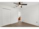 Bedroom with wood-look flooring, double-door closet, and ceiling fan at 3591 Sandlor Dr, Deltona, FL 32738