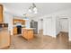 Open kitchen layout with a granite island, black appliances, and tile flooring at 3591 Sandlor Dr, Deltona, FL 32738