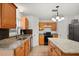 Functional kitchen featuring granite countertops, stainless steel sink, and ample cabinetry at 3591 Sandlor Dr, Deltona, FL 32738