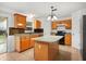 Well-equipped kitchen with an island, granite countertops, and modern appliances at 3591 Sandlor Dr, Deltona, FL 32738