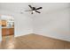 Inviting living room featuring tile floors, ceiling fan, and a view to the kitchen at 3591 Sandlor Dr, Deltona, FL 32738