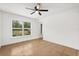 Bright living room with tile flooring, ceiling fan, and natural light from the window at 3591 Sandlor Dr, Deltona, FL 32738