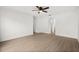 Open living room featuring bright white walls and wood-style floors at 3591 Sandlor Dr, Deltona, FL 32738