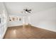 Bright, open-concept living room with tile floors and view of the kitchen at 3591 Sandlor Dr, Deltona, FL 32738