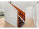 Traditional stairway with wood railing and accents leading to the upper level at 3591 Sandlor Dr, Deltona, FL 32738