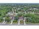 Aerial view of a lovely home nestled in a lush, green, neighborhood surrounded by mature trees at 37 N Tymber Crk, Ormond Beach, FL 32174