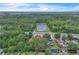 Aerial view of property near pond, green space, and access to highway at 37 N Tymber Crk, Ormond Beach, FL 32174