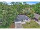 Charming single-story home featuring a well-maintained lawn, mature trees, and a quaint, landscaped yard at 37 N Tymber Crk, Ormond Beach, FL 32174