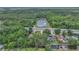 Aerial view of property near pond, green space, and access to highway at 37 N Tymber Crk, Ormond Beach, FL 32174