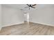 Bright bedroom features new floors, a ceiling fan, and a connecting doorway at 37 N Tymber Crk, Ormond Beach, FL 32174
