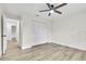 This room features hardwood floors and a ceiling fan over an off-white painted room with closet at 37 N Tymber Crk, Ormond Beach, FL 32174