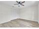 Bright bedroom featuring updated floors, a ceiling fan, and closet space at 37 N Tymber Crk, Ormond Beach, FL 32174