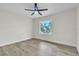This room features hardwood floors and a ceiling fan over an off-white painted room at 37 N Tymber Crk, Ormond Beach, FL 32174