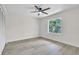 Bedroom featuring updated floors, a ceiling fan, and a window at 37 N Tymber Crk, Ormond Beach, FL 32174