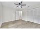 Bright bedroom featuring updated floors, a ceiling fan, closet space, and connected room at 37 N Tymber Crk, Ormond Beach, FL 32174