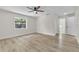 Bright bedroom with new flooring, ceiling fan, and a large window at 37 N Tymber Crk, Ormond Beach, FL 32174