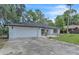 Beautiful one-story home with black shutters, a two car garage and a well manicured yard at 37 N Tymber Crk, Ormond Beach, FL 32174