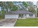Charming home with a two-car garage, manicured lawn and a pristine exterior at 37 N Tymber Crk, Ormond Beach, FL 32174