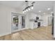 Open kitchen with modern lighting and white cabinets, providing ample space and style at 37 N Tymber Crk, Ormond Beach, FL 32174