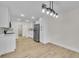 Open kitchen with modern lighting, and plenty of cabinet and counter space at 37 N Tymber Crk, Ormond Beach, FL 32174