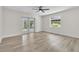 Bright, airy living room features light wood floors, patio access, and large window at 37 N Tymber Crk, Ormond Beach, FL 32174