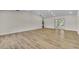 Large living room with luxury vinyl flooring and access to the backyard at 37 N Tymber Crk, Ormond Beach, FL 32174