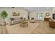 Cozy staged living room with neutral tones and comfortable furniture at 37 N Tymber Crk, Ormond Beach, FL 32174