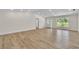 Large living room with luxury vinyl flooring and access to the front yard at 37 N Tymber Crk, Ormond Beach, FL 32174