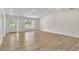 Bright living room with luxury vinyl flooring and access to the front yard at 37 N Tymber Crk, Ormond Beach, FL 32174
