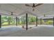 Back patio with ceiling fans and a landscaped view at 37 N Tymber Crk, Ormond Beach, FL 32174