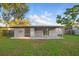 The covered back patio provides a great view of the green backyard at 3927 Citadel Dr, Orlando, FL 32839