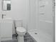 A compact bathroom highlighting a standing shower, modern toilet, and sleek vanity at 3927 Citadel Dr, Orlando, FL 32839