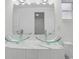 Bathroom with double glass vessel sinks, marble countertop, and updated vanity at 3927 Citadel Dr, Orlando, FL 32839