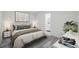 This bedroom features modern decor, stylish furniture, and a serene ambiance with art and gray-toned flooring at 3927 Citadel Dr, Orlando, FL 32839