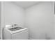 Clean, white laundry area featuring a modern washing machine, perfect for convenient home care at 3927 Citadel Dr, Orlando, FL 32839