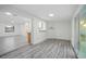 Bright living room featuring modern vinyl floors, large sliding doors and recessed lighting at 3927 Citadel Dr, Orlando, FL 32839
