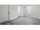 Entry and mud room with modern gray wood-look vinyl flooring and a bright white door at 3927 Citadel Dr, Orlando, FL 32839