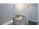 Bathroom featuring granite countertops, vanity cabinet and modern fixtures at 4226 Kelly Miller Ct, Orlando, FL 32811