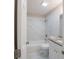 Bathroom featuring granite countertops, shower over tub with tile surround and modern fixtures at 4226 Kelly Miller Ct, Orlando, FL 32811