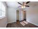 This bedroom features a ceiling fan, wood floors, neutral walls, and a closet at 4226 Kelly Miller Ct, Orlando, FL 32811