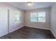 Bright bedroom with hardwood floors, fresh paint and two windows offering plenty of natural light at 4226 Kelly Miller Ct, Orlando, FL 32811