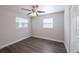 Bright bedroom with hardwood floors, fresh paint, and a ceiling fan providing comfort at 4226 Kelly Miller Ct, Orlando, FL 32811