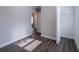Bedroom featuring neutral walls, wood-look floors, an open closet and a door leading to another room at 4226 Kelly Miller Ct, Orlando, FL 32811