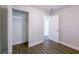 Bedroom featuring an open closet, neutral walls, and a view into the next room at 4226 Kelly Miller Ct, Orlando, FL 32811